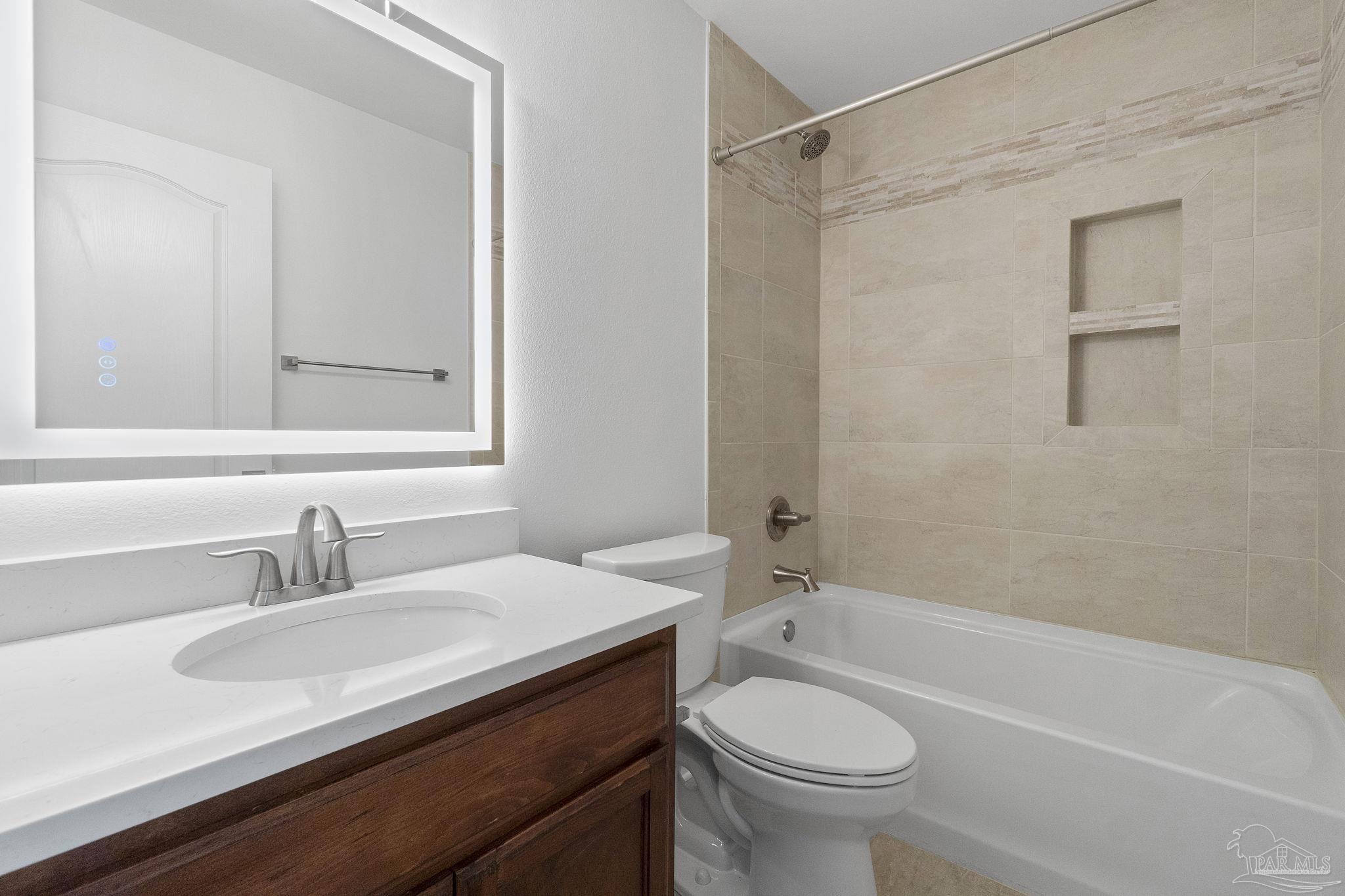 576 Edith Lane Pensacola, FL 32534 - Photo 32 of 38 a bathroom with a sink a toilet and a bathtub