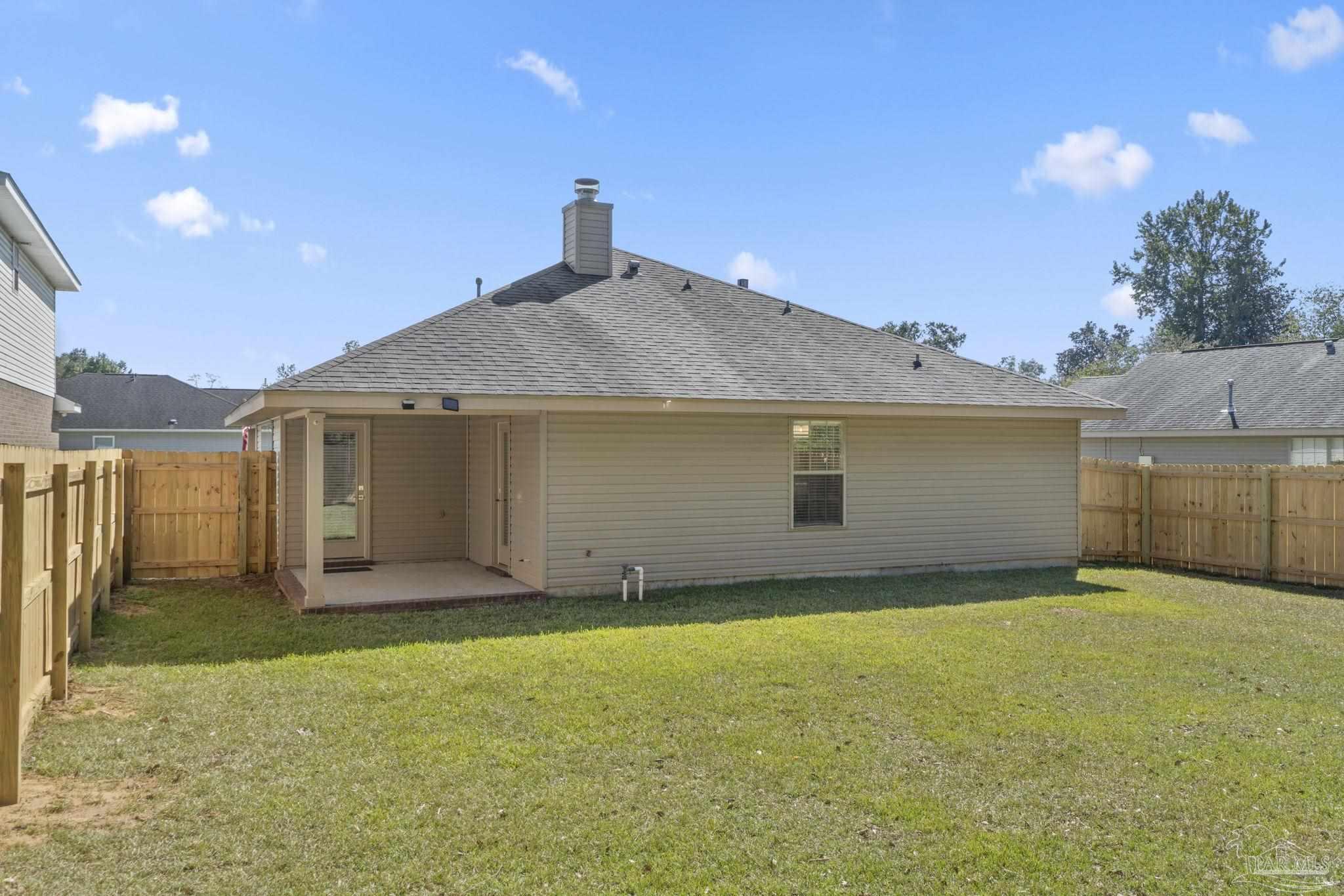 576 Edith Lane Pensacola, FL 32534 - Photo 36 of 38 a view of a house with backyard and garage