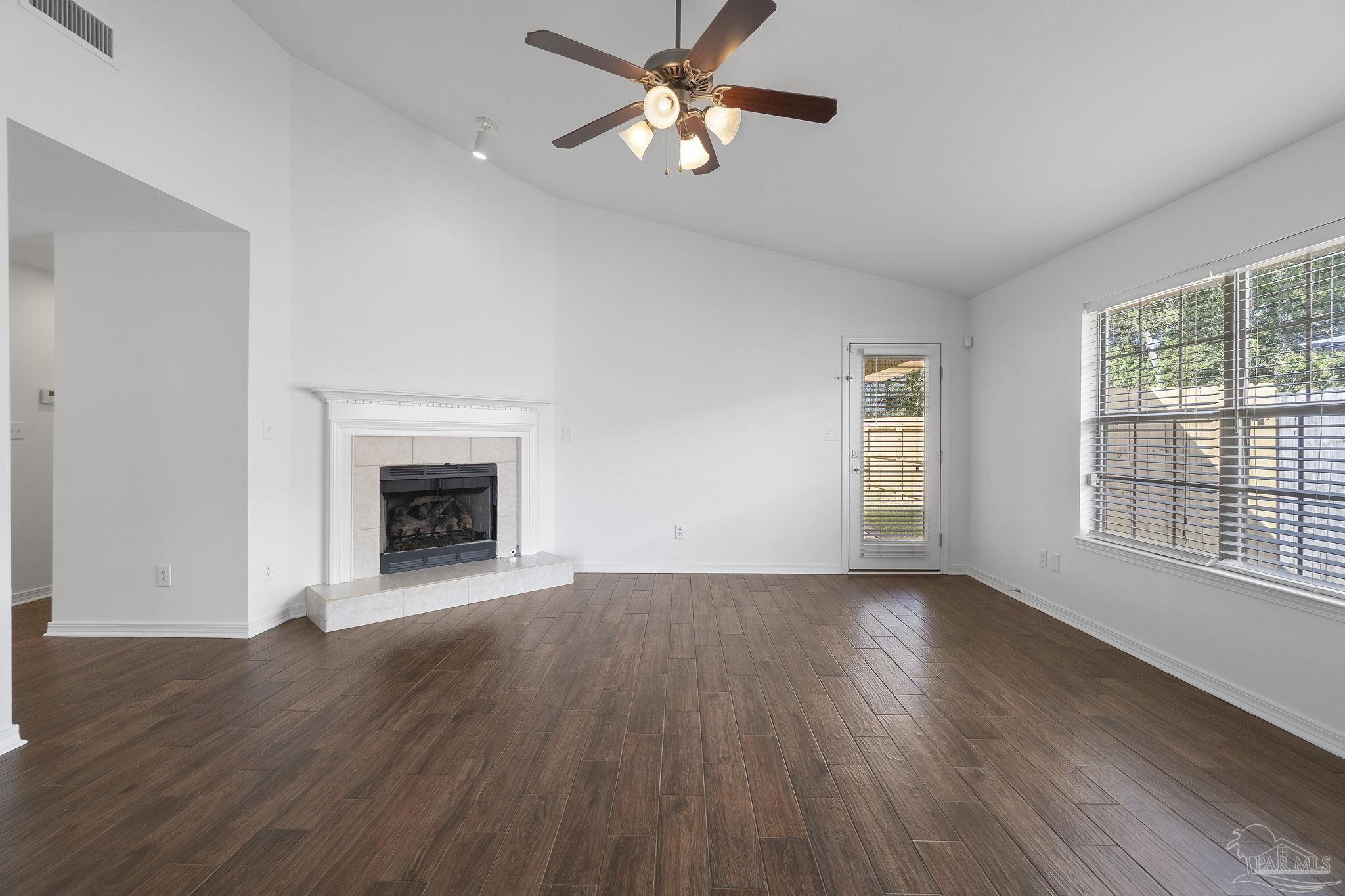 576 Edith Lane Pensacola, FL 32534 - Photo 10 of 38 a view of empty room with wooden floor and fan