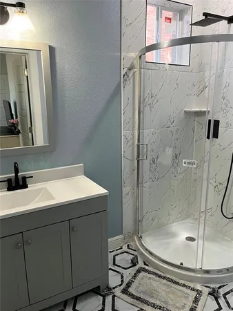 a bathroom with a sink a toilet and mirror
