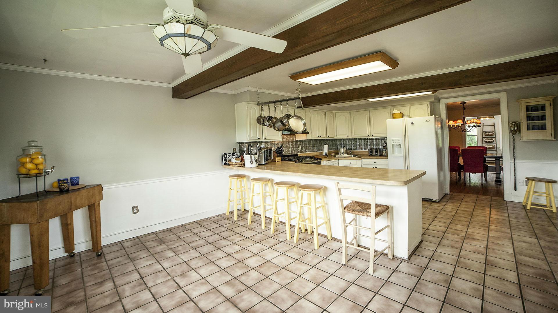 28901 Kemptown Road Mount Airy, MD 21771 - Photo 13 of 29 a kitchen with a sink a stove cabinets and counter space
