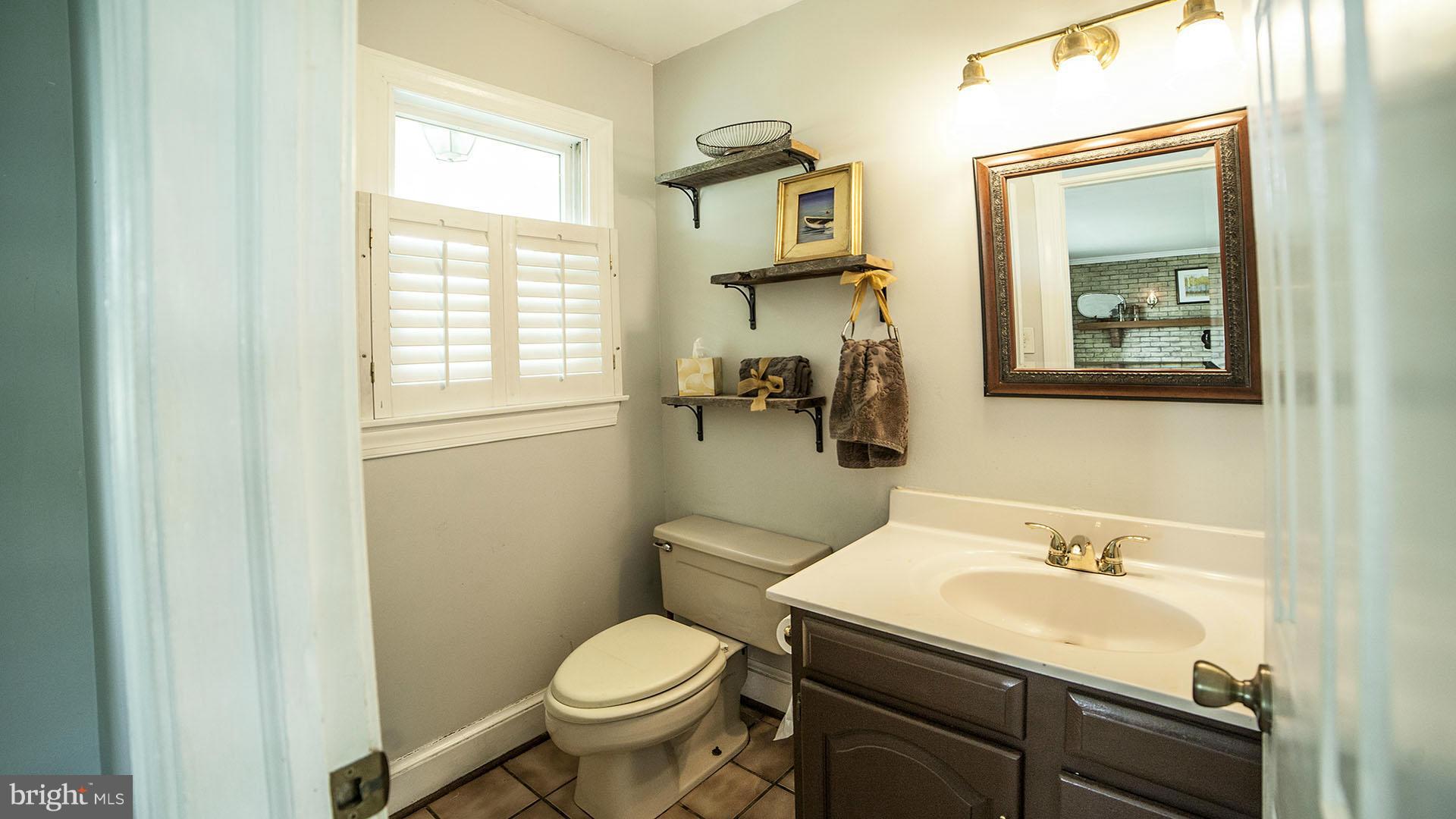28901 Kemptown Road Mount Airy, MD 21771 - Photo 14 of 29 a bathroom with a sink toilet and window