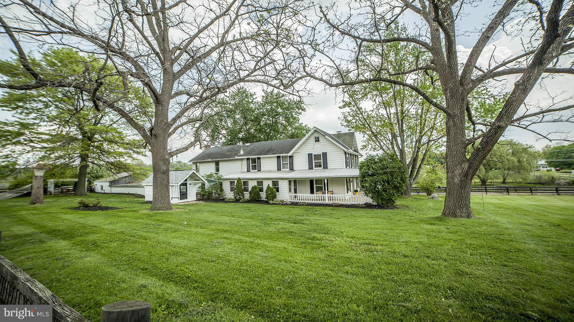 28901 Kemptown Road Mount Airy, MD 21771 - Photo 3 of 29 a view of a house with a big yard and large trees