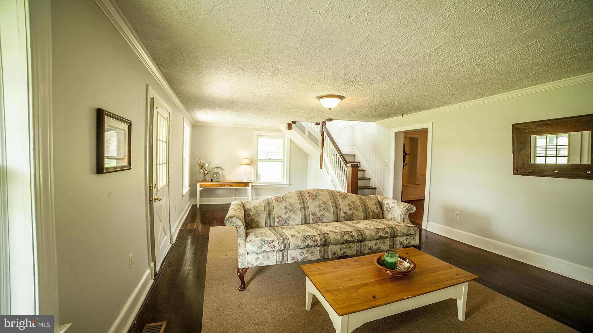 28901 Kemptown Road Mount Airy, MD 21771 - Photo 5 of 29 a living room with furniture and a couch