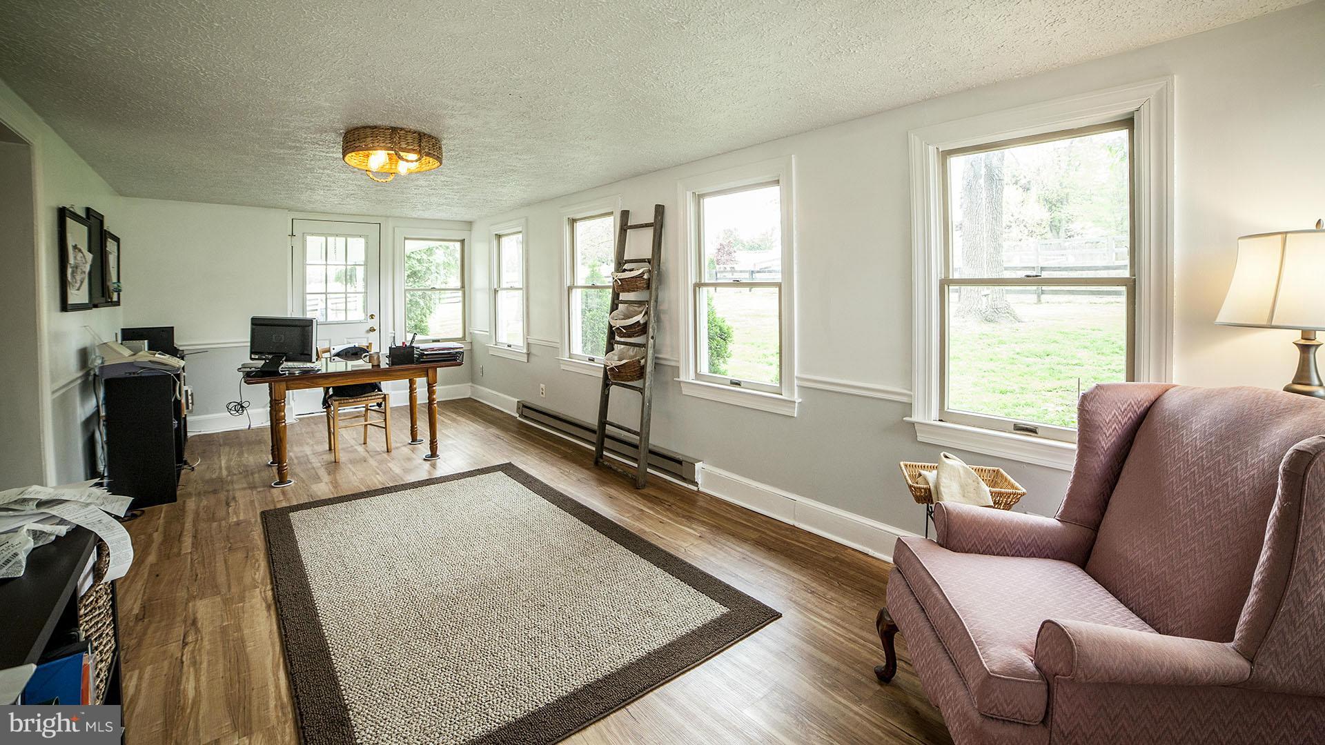 28901 Kemptown Road Mount Airy, MD 21771 - Photo 8 of 29 a living room with furniture and a large window