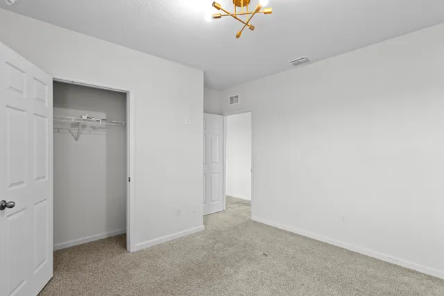 a view of a livingroom with a ceiling fan and window