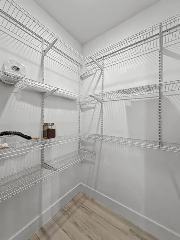 a view of a room with racks on the wall