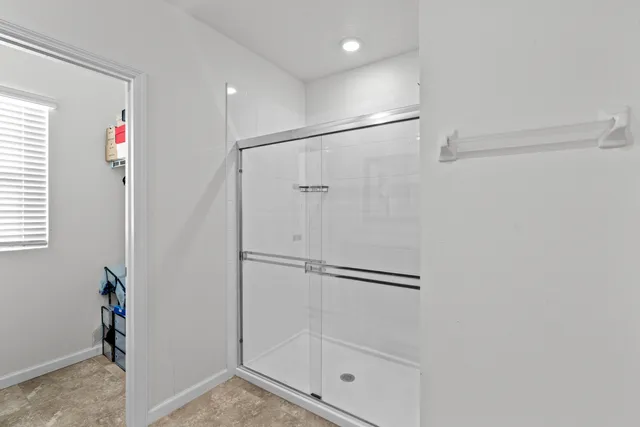 a bathroom with a toilet and a bathtub