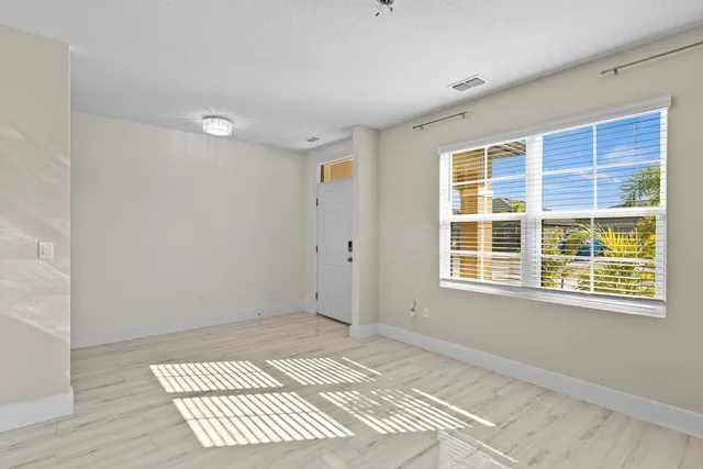 a view of an empty room with a window