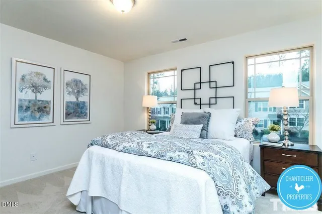 a bedroom with a large bed and a window