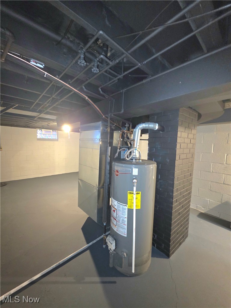 6660 State Road Parma, OH 44134 - Photo 21 of 25 Utility room featuring water heater and heating unit