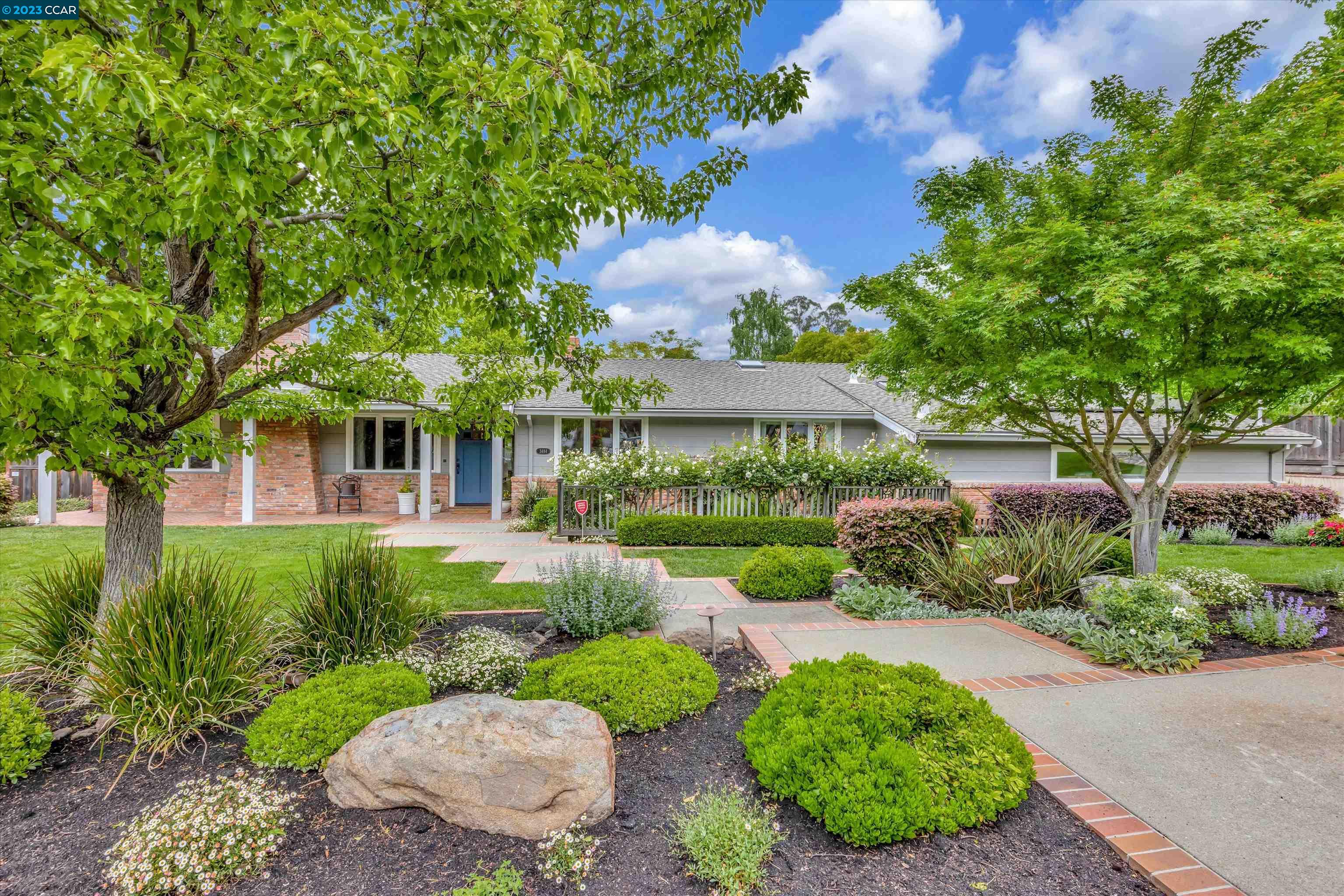 front view of a house with a yard