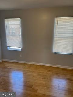 5644 Appletree Street Philadelphia, PA 19139 - Photo 2 of 12 an empty room with wooden floor and windows