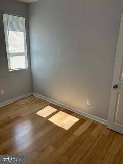 5644 Appletree Street Philadelphia, PA 19139 - Photo 3 of 12 an empty room with wooden floor and windows
