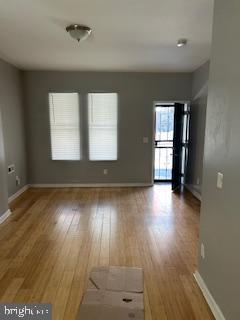 5644 Appletree Street Philadelphia, PA 19139 - Photo 8 of 12 an empty room with wooden floor and windows