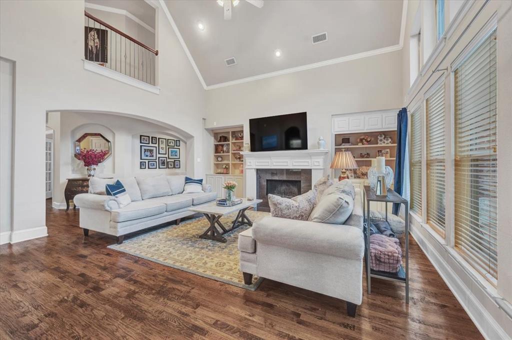 2015 Midhurst Drive Allen, TX 75013 - Photo 11 of 37 a living room with furniture flat screen tv and a fireplace