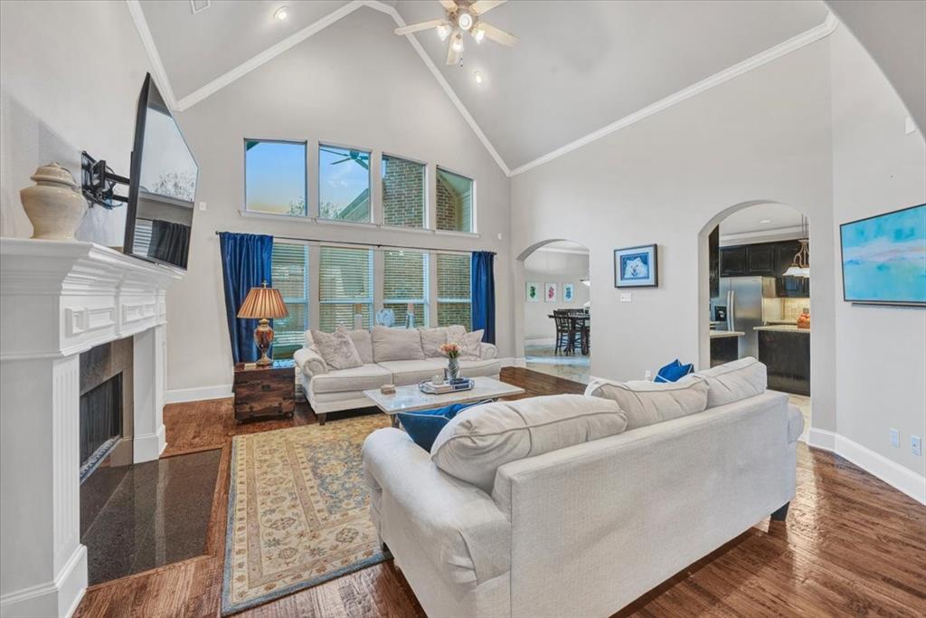 2015 Midhurst Drive Allen, TX 75013 - Photo 12 of 37 a living room with furniture fireplace and a flat screen tv