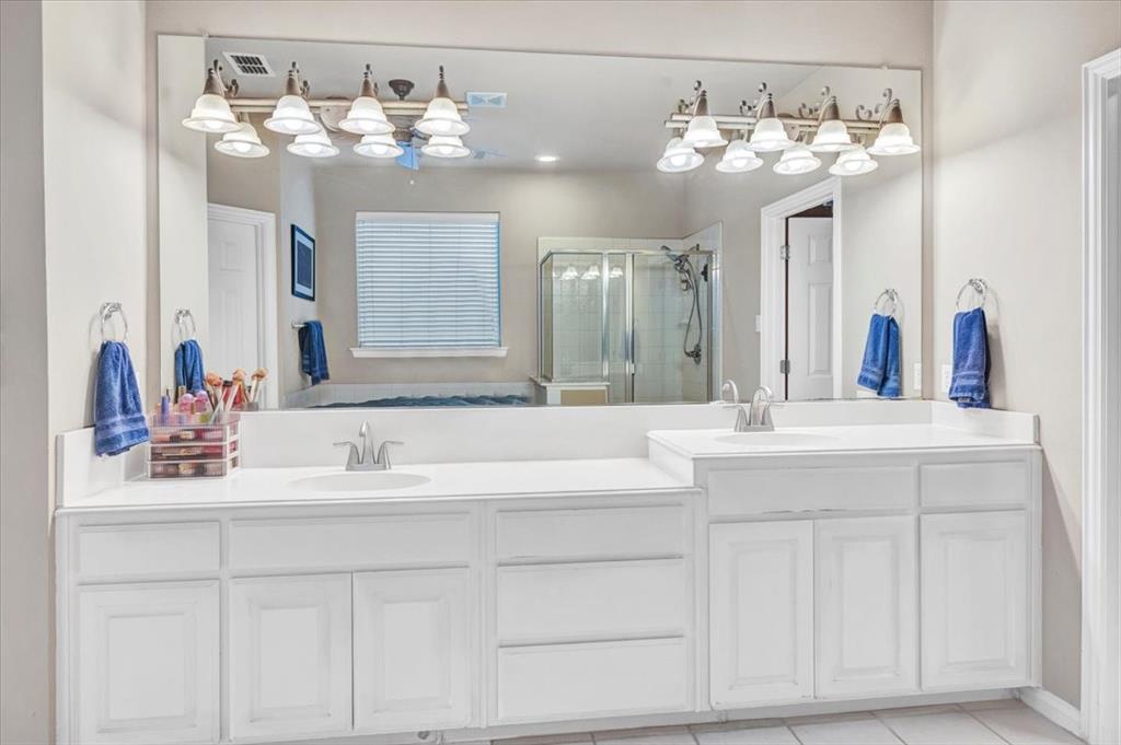 2015 Midhurst Drive Allen, TX 75013 - Photo 15 of 37 a bathroom with a sink vanity and a mirror