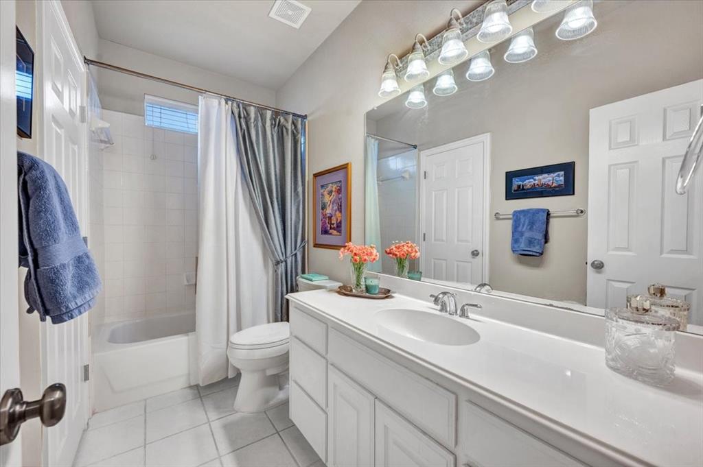 2015 Midhurst Drive Allen, TX 75013 - Photo 19 of 37 a bathroom with a sink a toilet and shower