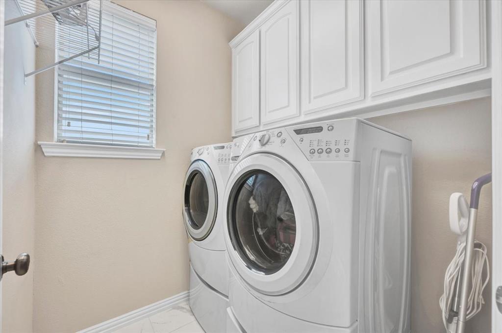 2015 Midhurst Drive Allen, TX 75013 - Photo 20 of 37 a utility room with dryer and washer