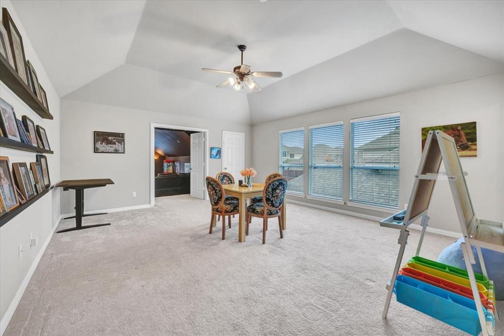 2015 Midhurst Drive Allen, TX 75013 - Photo 21 of 37 a dining room with furniture and a floor to ceiling window