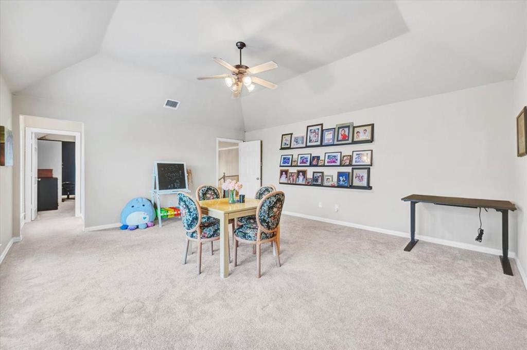 2015 Midhurst Drive Allen, TX 75013 - Photo 22 of 37 a dining room with furniture and a chandelier