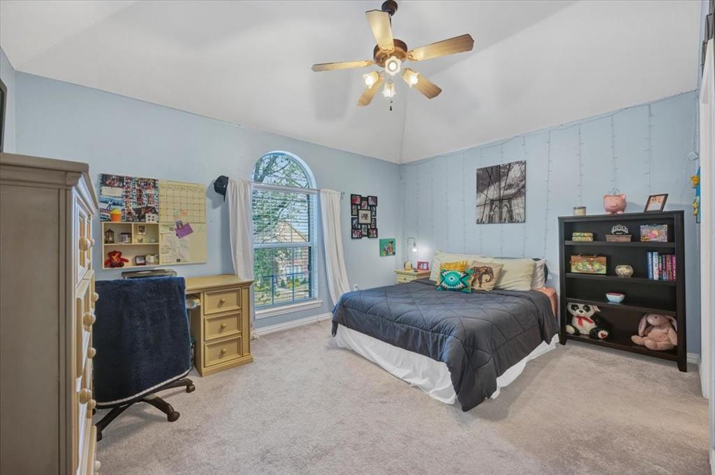 2015 Midhurst Drive Allen, TX 75013 - Photo 24 of 37 a bedroom with a bed and a table