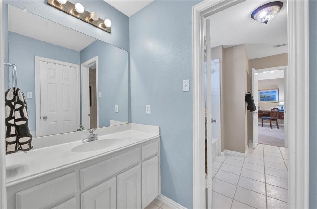 2015 Midhurst Drive Allen, TX 75013 - Photo 26 of 37 a en suite bathroom with a sink and a mirror