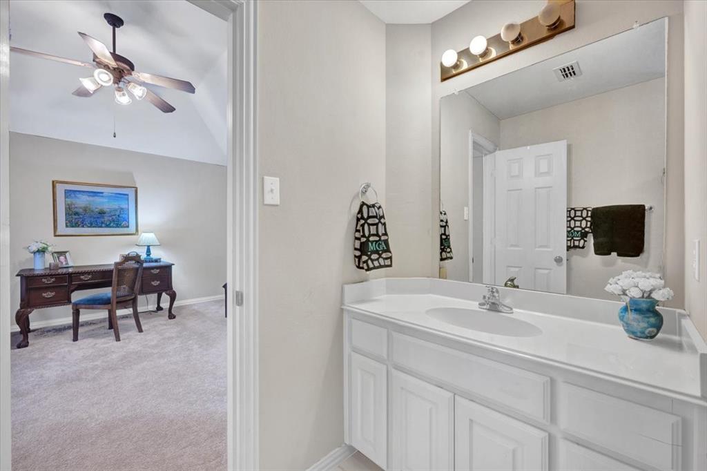 2015 Midhurst Drive Allen, TX 75013 - Photo 27 of 37 a bathroom with a sink double vanity and a mirror