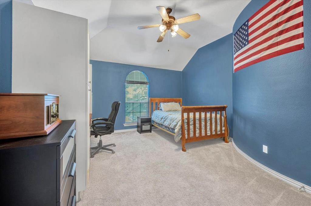 2015 Midhurst Drive Allen, TX 75013 - Photo 29 of 37 a bedroom with furniture and a window