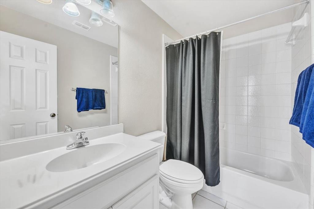 2015 Midhurst Drive Allen, TX 75013 - Photo 30 of 37 a bathroom with a sink and a mirror