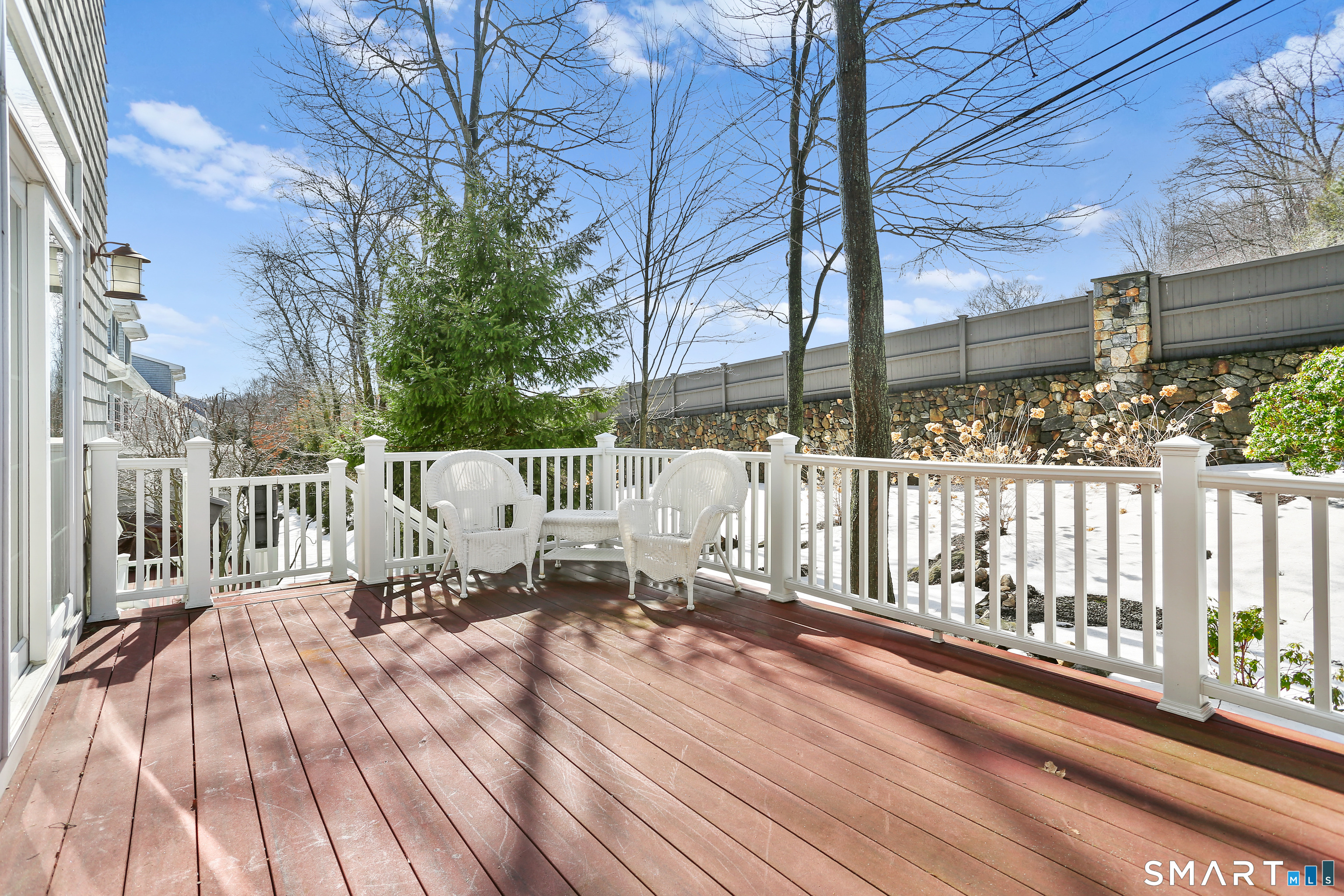 2 Trout Creek Road, Unit 2 Shelton, CT 06484 - Photo 13 of 38 Spacious, low-maintenance deck ideal for outdoor seating overlooking peaceful landscaped surroundings.
