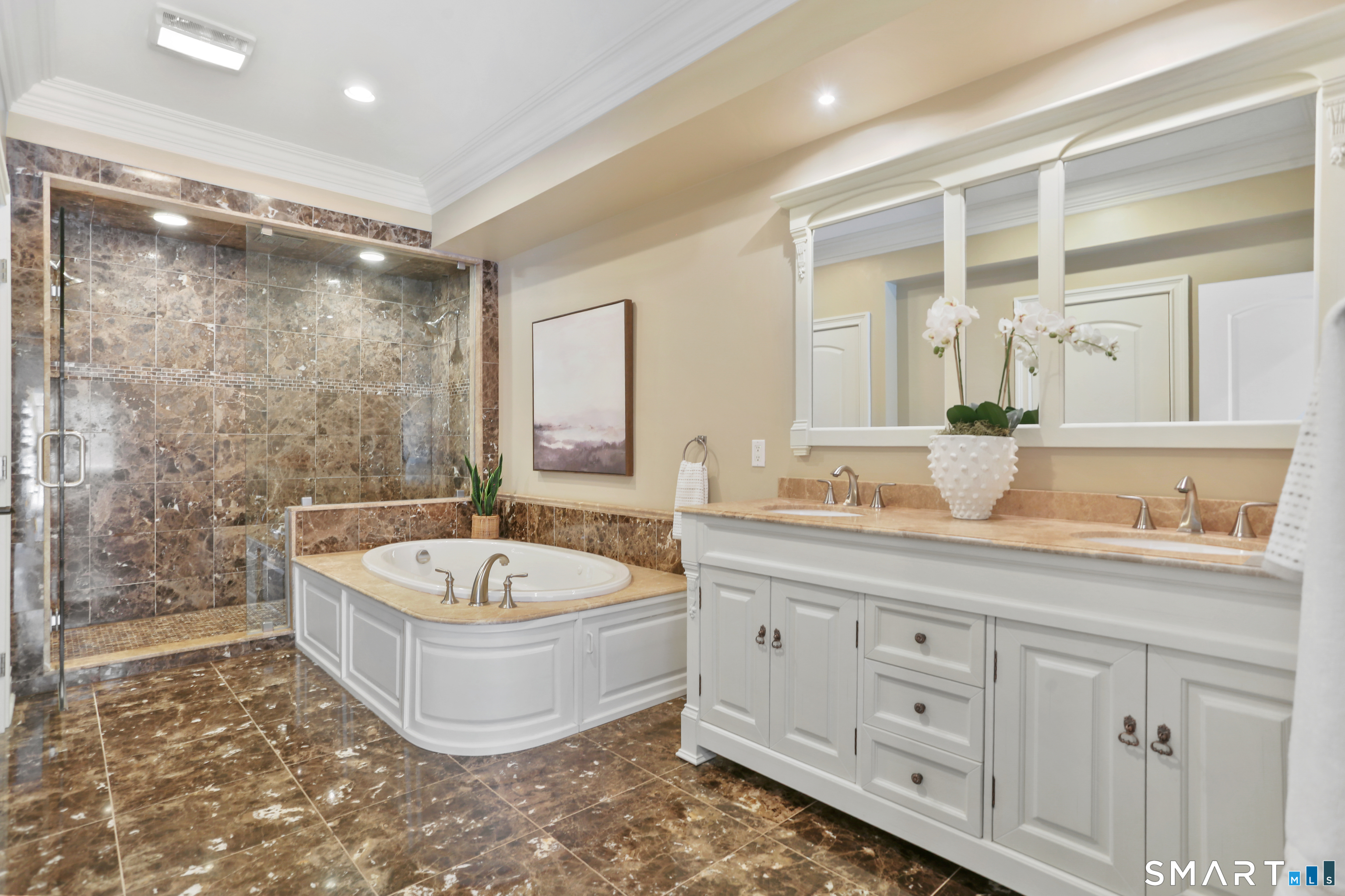 2 Trout Creek Road, Unit 2 Shelton, CT 06484 - Photo 21 of 38 Luxurious primary bath with marble flooring, double sized shower, and soaking tub make this the ultimate spa-like experience.