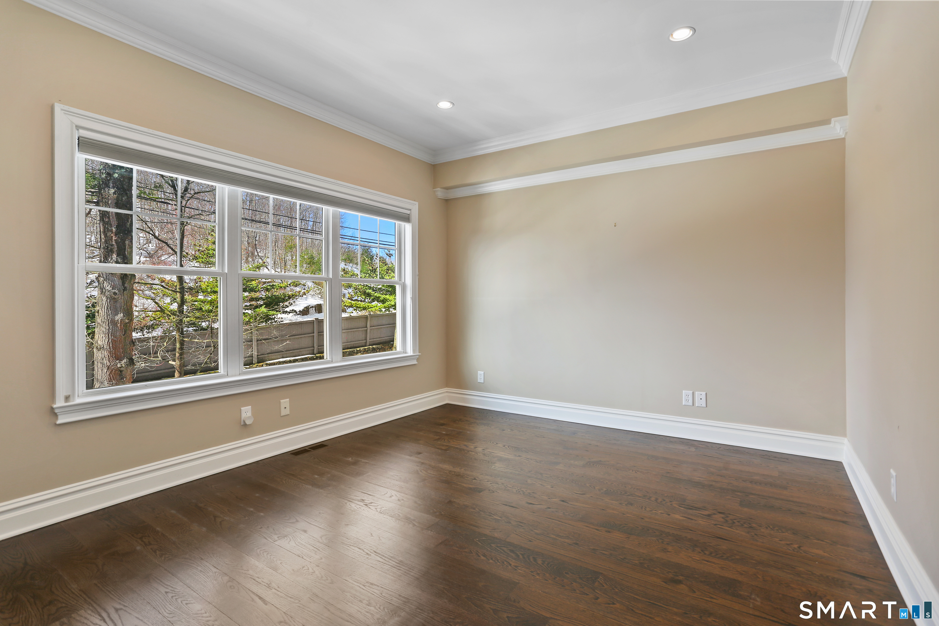 2 Trout Creek Road, Unit 2 Shelton, CT 06484 - Photo 23 of 38 Bright and comfortable second-floor bedroom with hardwood floors and large window overlooking the landscaped surroundings.