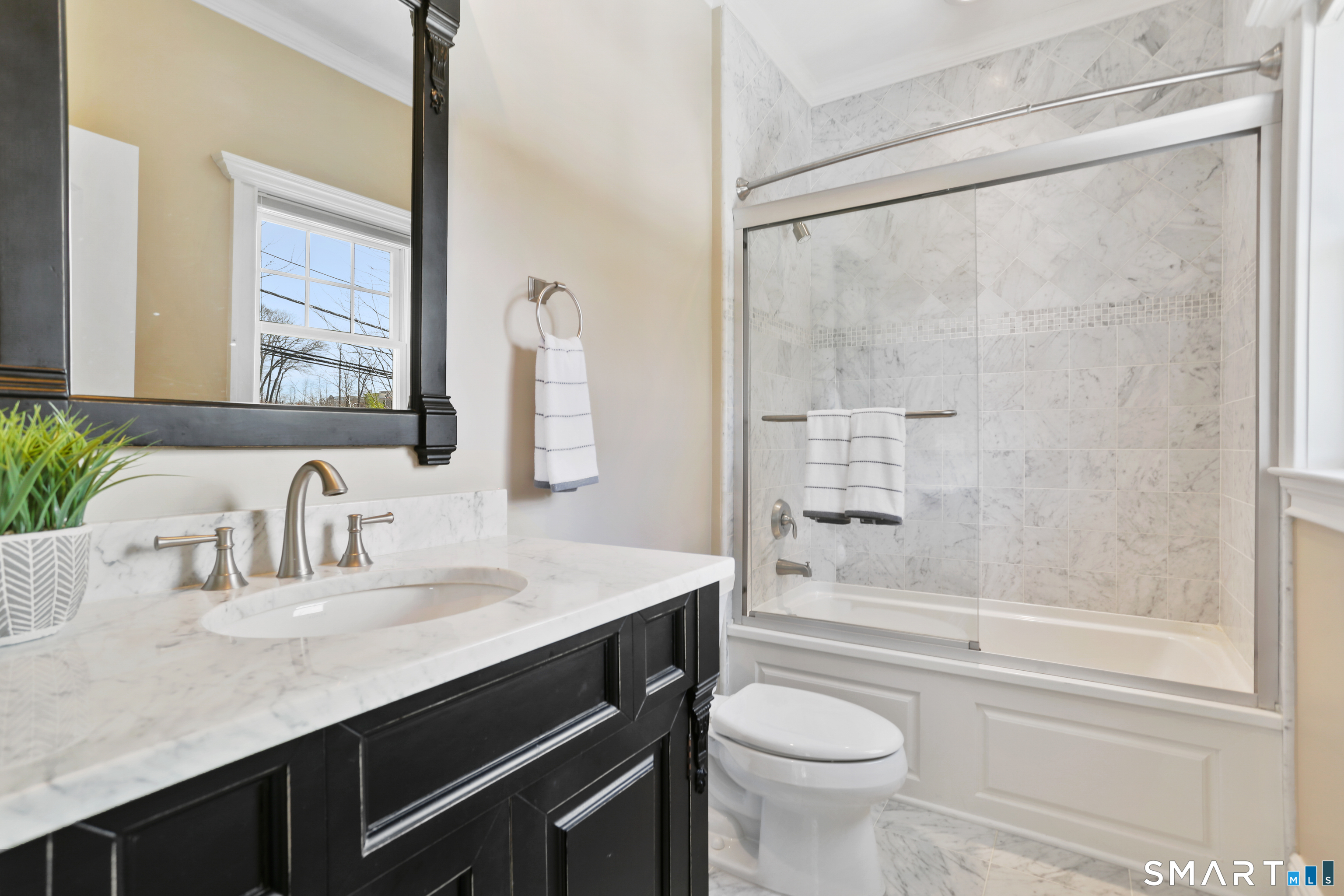 2 Trout Creek Road, Unit 2 Shelton, CT 06484 - Photo 25 of 38 Well-appointed en suite bath featuring a vanity and tub/shower combination, providing comfort and privacy for guests.