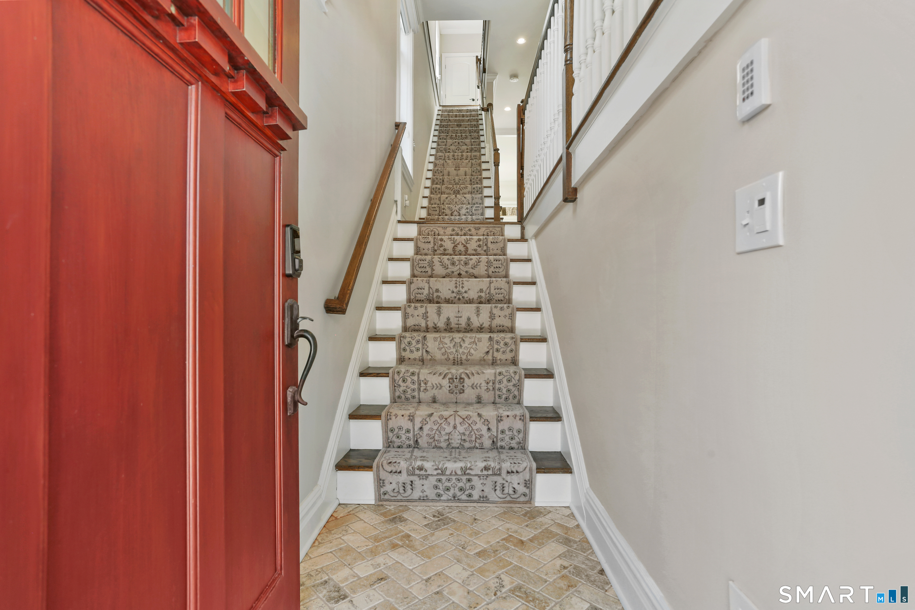 2 Trout Creek Road, Unit 2 Shelton, CT 06484 - Photo 3 of 38 Welcoming foyer with herringbone tile flooring and staircase leading to the main living level.