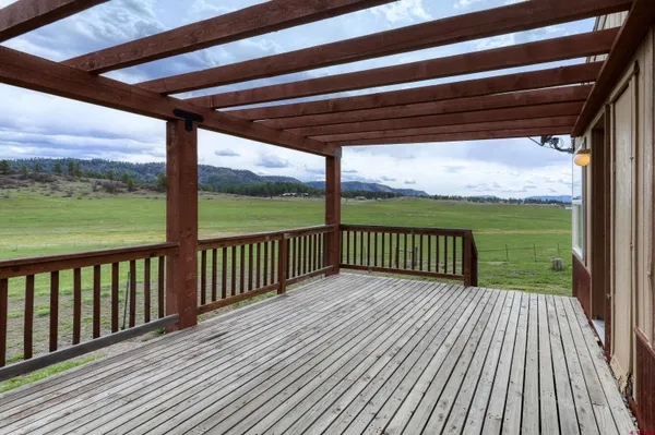 a view of balcony with wooden floor