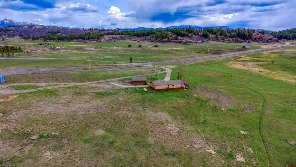 a view of a golf course with a big yard