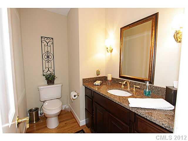 3100 High Ridge Road Charlotte, NC 28270 - Photo 11 of 16 a bathroom with a granite countertop toilet a sink and mirror