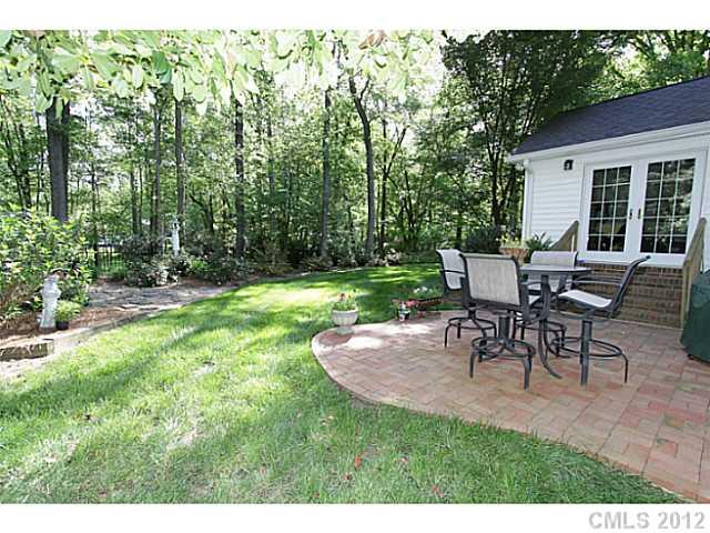 3100 High Ridge Road Charlotte, NC 28270 - Photo 3 of 16 a view of a backyard with table and chairs with a yard and plants