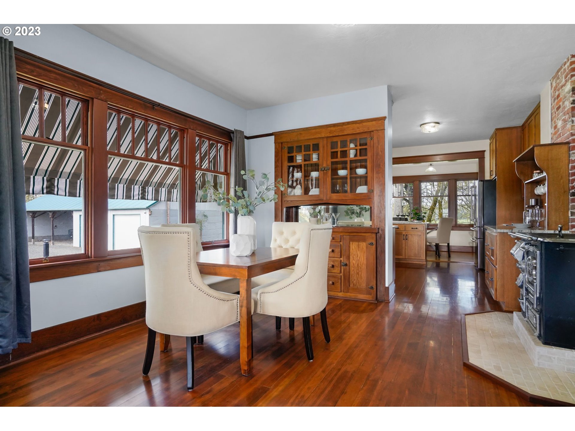 34466 Brewster Road Lebanon, OR 97355 - Photo 6 of 40 a view of a dining room with furniture window and wooden floor