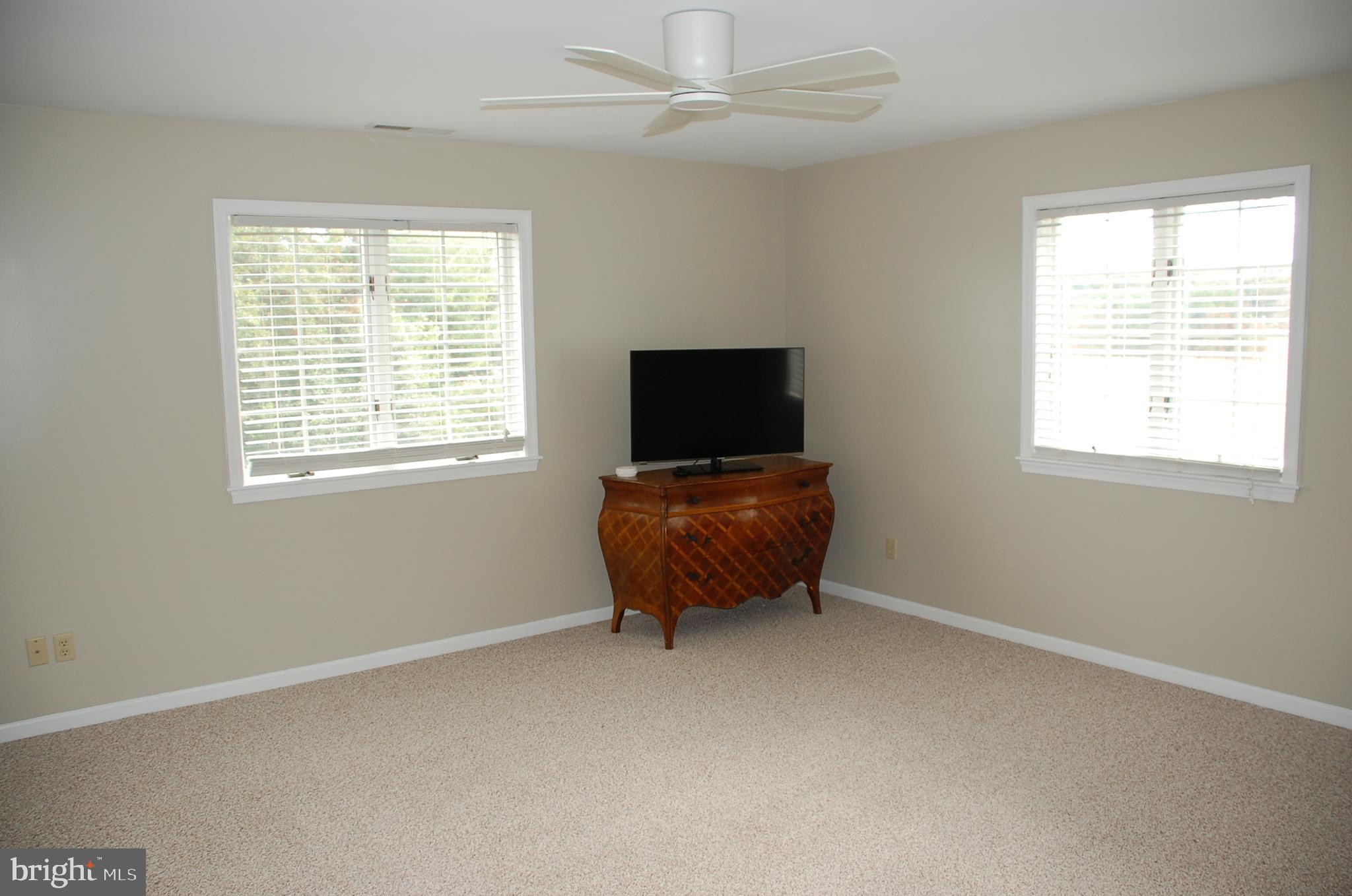 15333 Hudson Road Milton, DE 19968 - Photo 19 of 28 a living room with a flat screen tv and a window