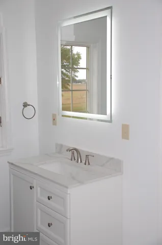 a bathroom with a sink and a vanity