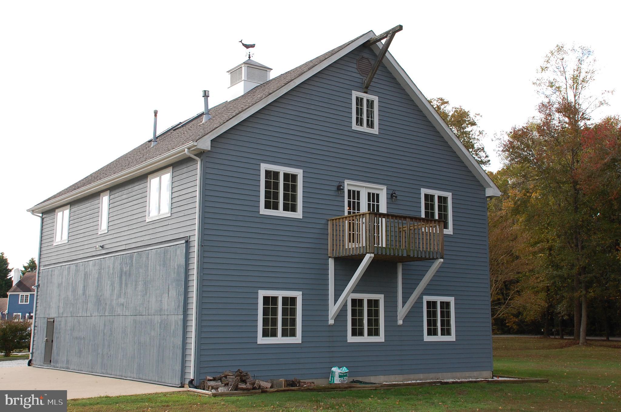 15333 Hudson Road Milton, DE 19968 - Photo 3 of 28 a front view of a house with a garden