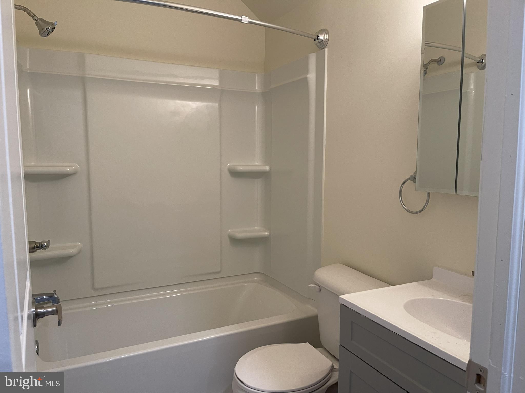 351-349 Oakwood Avenue, Unit 351A Glassboro, NJ 08028 - Photo 2 of 4 a bathroom with a toilet and a bathtub