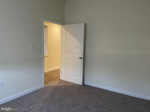 an empty room with an empty space and a window