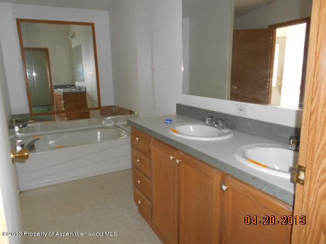 141 Daniel Avenue Rifle, CO 81650 - Photo 8 of 13 a bathroom with a sink and a mirror