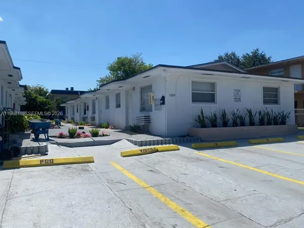 a swimming pool with outdoor seating and yard