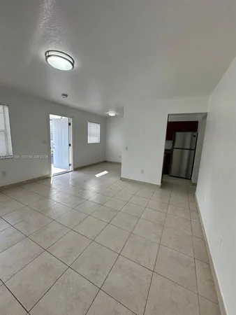 an empty room with a bathroom