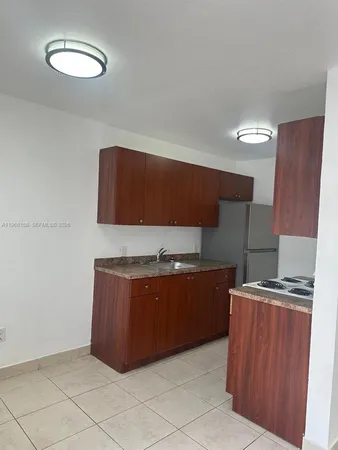 a kitchen with stainless steel appliances a stove and a refrigerator